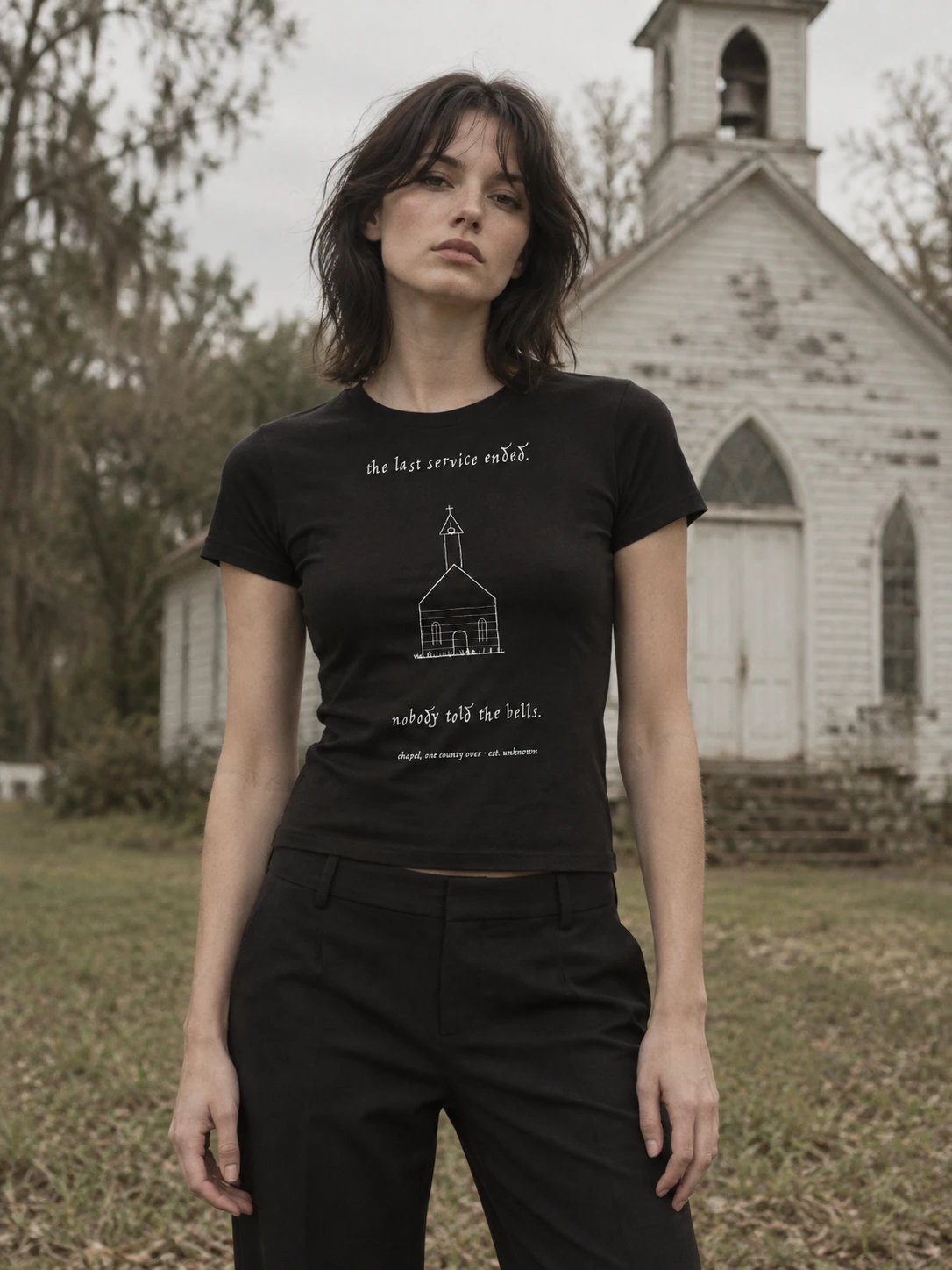 AI-generated campaign portrait of an adult model wearing the the chapel baby tee; original product photographs are available in the file