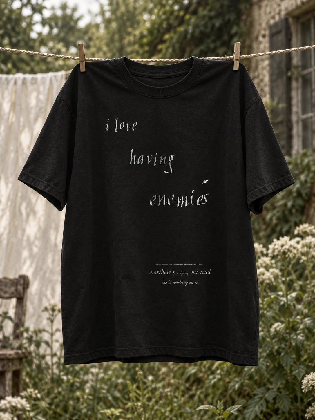 lot no. 004, the confession tee — the confession screen printed with three claw marks torn through the word