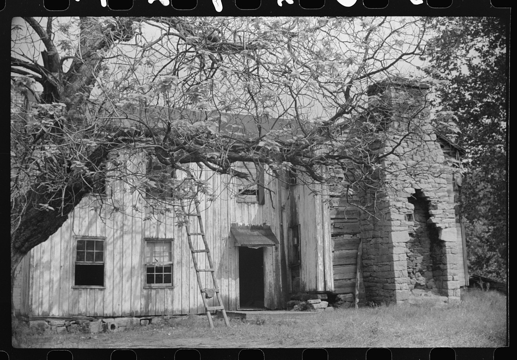 an old abandoned farmhouse on the main highway between morgantown and elkins, west virginia